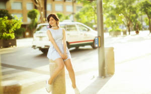 Chinese Woman Posing In City Wallpaper