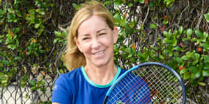 Chris Evert Smiling In Blue Wallpaper