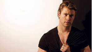 Chris Hemsworth In A Black Shirt Wallpaper
