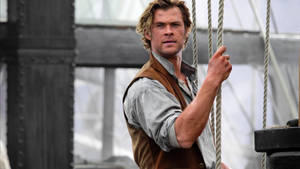 Chris Hemsworth Shines In His Role As Owen Chase In The Titular Movie Wallpaper
