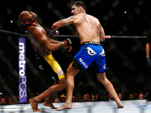 Chris Weidman Capturing Victory Over Anderson Silva Wallpaper