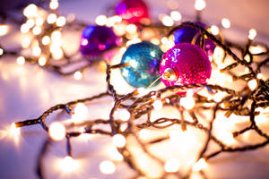 Christmas Balls And Yellow Festive Christmas Lights Tight Shot Wallpaper