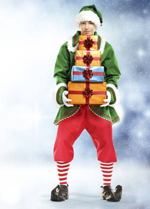 Christmas Elf With Orange Boxes Wallpaper