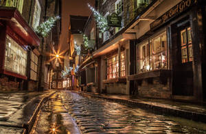 Christmas Lights Reflected In A Rainy London Street Wallpaper