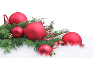 Christmas Tree With Red Ornaments And White Fur Wallpaper