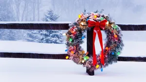 Christmas Wreath Covered In Snow Wallpaper