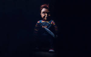 Chucky Buddi Holding Knife Wallpaper