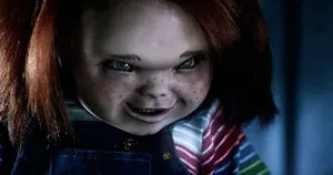 Chucky Doll Grinning During A Fight Wallpaper