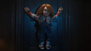 Chucky Doll Impaled On A Door Wallpaper