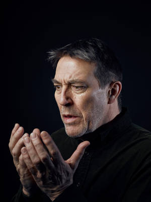 Ciarán Hinds Actor Portrait Sitting Wallpaper