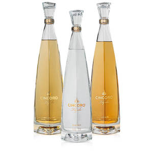 Cincoro Tequila Bottles On White Background Wallpaper