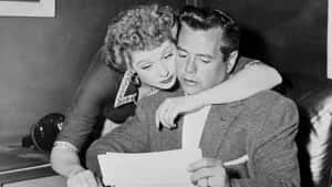 Classic Black-and-white Of Lucille Ball And Desi Arnaz In 