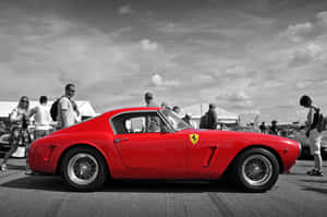 “classic Elegance With A Vintage Ferrari” Wallpaper