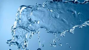 Clear Blue Skies And Refreshing Water Splash. Wallpaper