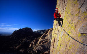 Climbing A Mossy Mountain Side Wallpaper