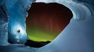 Climbing With Aurora Borealis Wallpaper