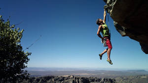 Climbing With One Hand Wallpaper