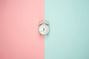 Clock On Pastel Backdrop Wallpaper