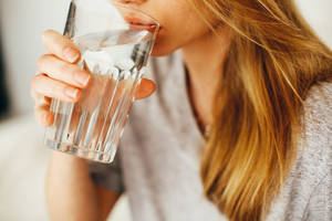 Close-up Of Woman Drinking Water Wallpaper