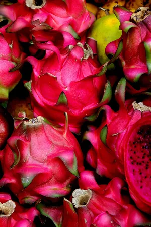 Close-up View Of Vibrant Dragonfruit Bunch Wallpaper
