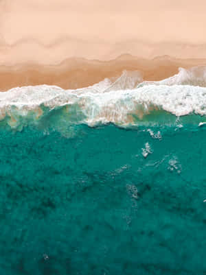 Closeup Of An Ocean-inspired Phone With Ocean Blues And Light Reflecting Off The Screen Wallpaper