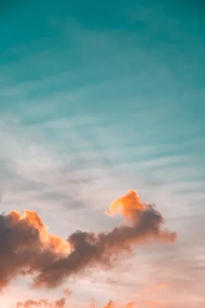 Cloudy Orange And Teal Sky Wallpaper