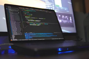 Coder Laptop With Codes Wallpaper