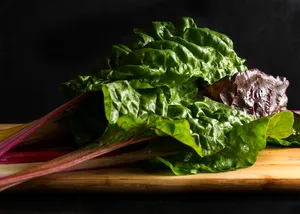 Colored Swiss Chard Vegetable On Wooden Board Wallpaper