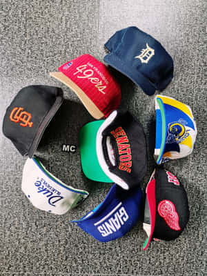 Colorful Caps From Sports Teams Wallpaper