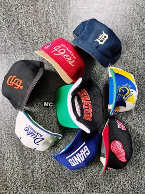 Colorful Caps From Sports Teams Wallpaper