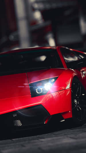 Colorful Red Car In Motion Wallpaper