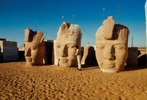 Colossal Statue's Faces At The Temple In Abu Simbel Wallpaper