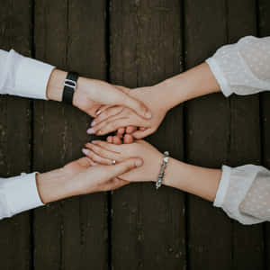 Compassionate Hands Together Wallpaper