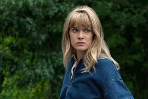 Concerned Womanin Denim Jacket Wallpaper