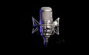 Condenser Microphone Shining In The Spotlight Wallpaper