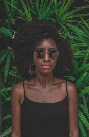 Confidence Speaks Volumes - Graceful Afro Queen Radiating In Her Natural Beauty Wallpaper