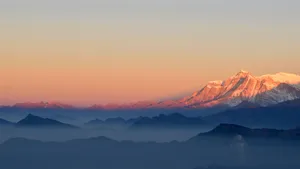 Conquer A 5k Run Through A Mountain's Snowy Peak Wallpaper