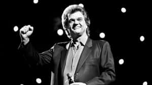 Conway Twitty Performingon Stage Wallpaper