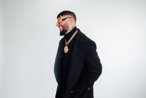 Cool Farruko On Black Trench Coat Wallpaper