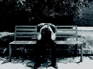 Cool Sad Boy Crying On Bench Wallpaper