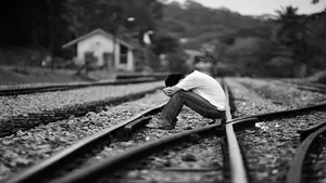 Cool Sad Boy On Train Tracks Wallpaper