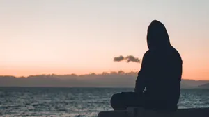 Cool Sad Boy Watching The Sea Wallpaper