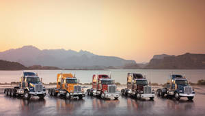 Cool Trucks Under Orange Sky Wallpaper