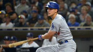 Corey Seager Swinging Bat In Uniform Wallpaper