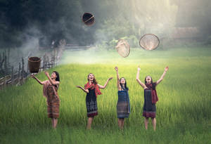 Country Summer Women Throwing Things Wallpaper