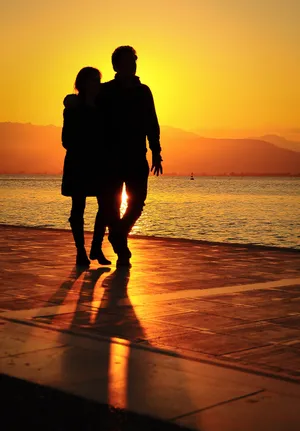 Couple At Beach Sunset Silhouette Wallpaper
