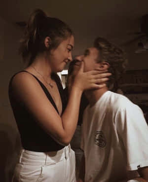 Couple Enjoying A Romantic Moment Together Wallpaper