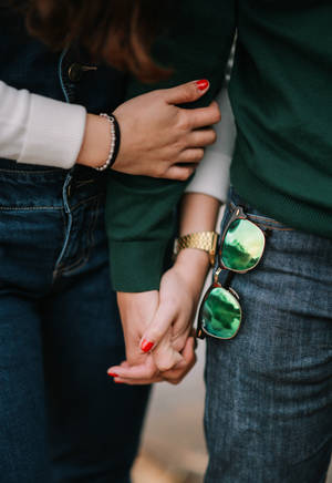 Couple Holding Hands Wallpaper