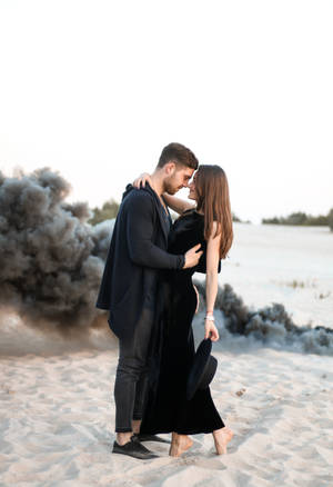 Couple Hugging In The Desert Wallpaper