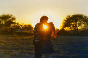 Couple Kiss On Sunrise Wallpaper